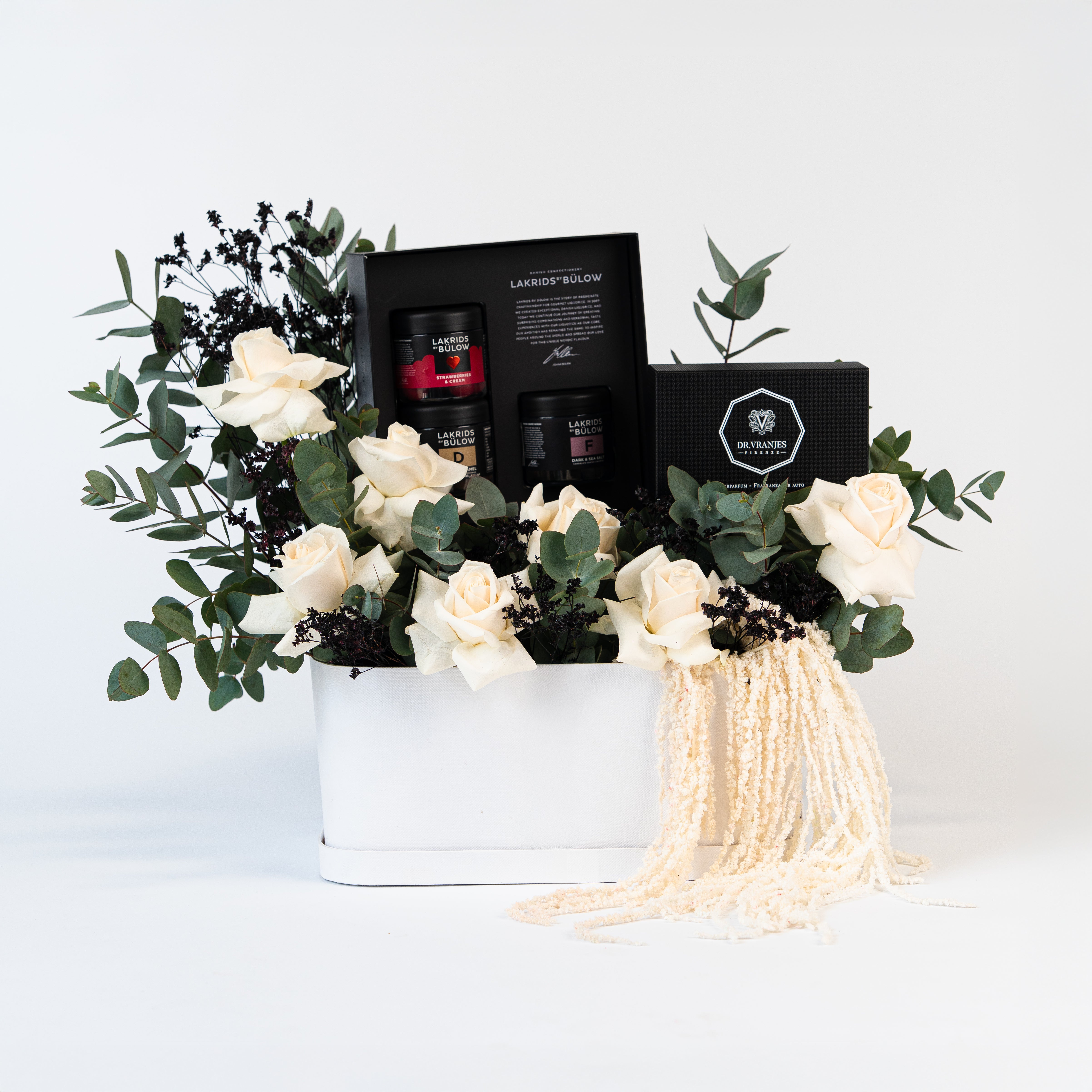 Bouquet of flowers in a white box with 'PAPAYA' branding on a peach background in dubai