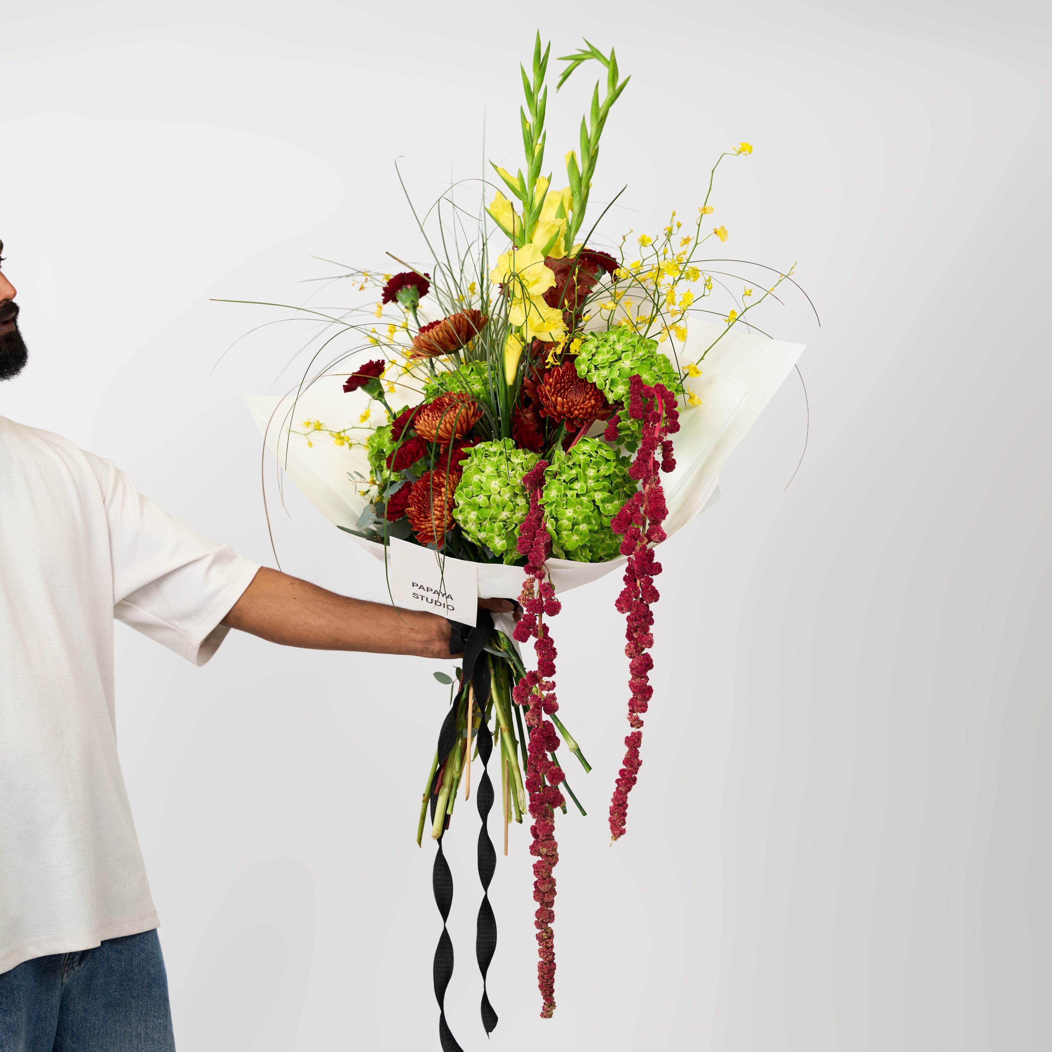 Golden Grove bouquet featuring lime-green blooms, golden yellow flowers and deep burgundy accents