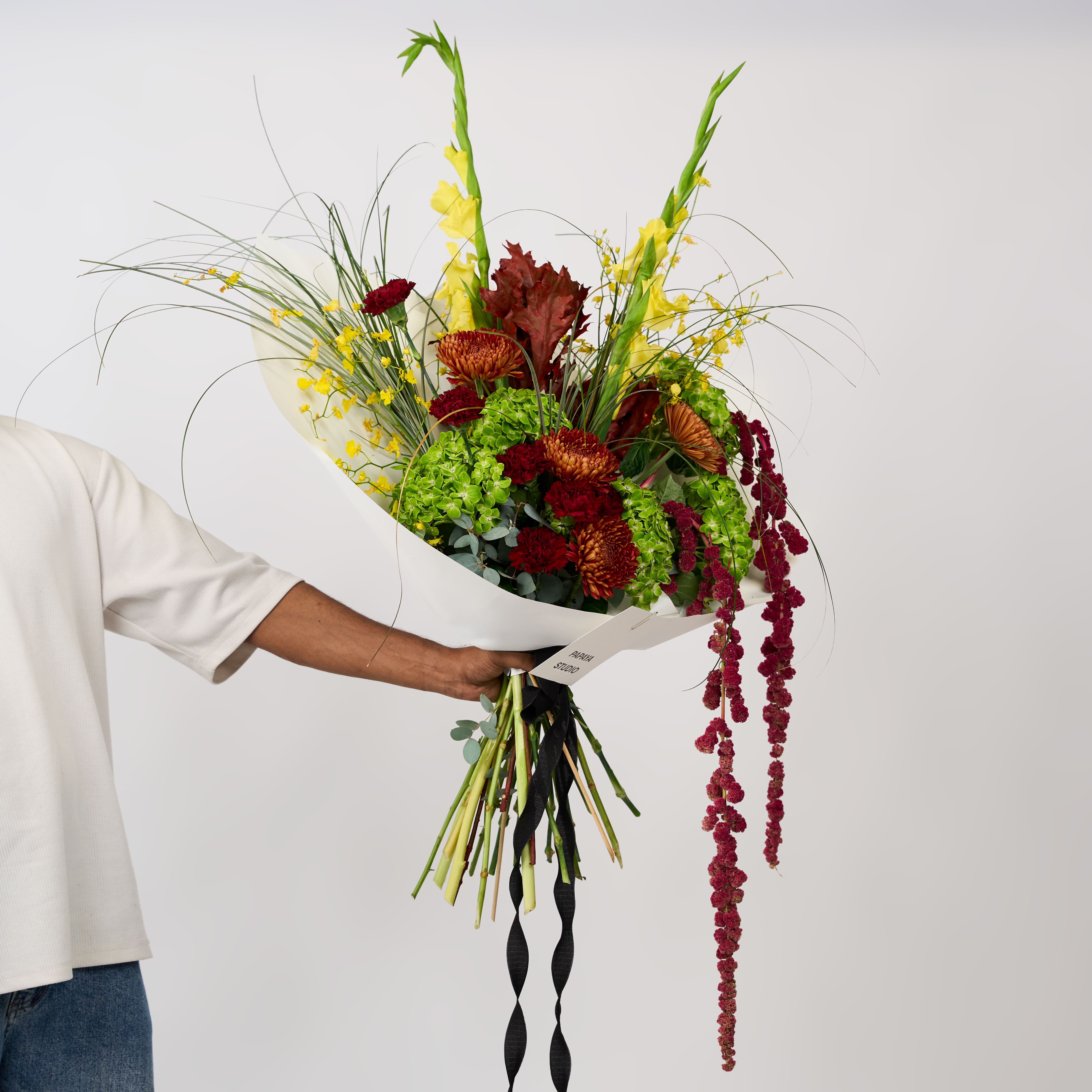 Mixed green, yellow, copper and burgundy flowers in Papaya Flower Studio’s Golden Grove bouquet.
