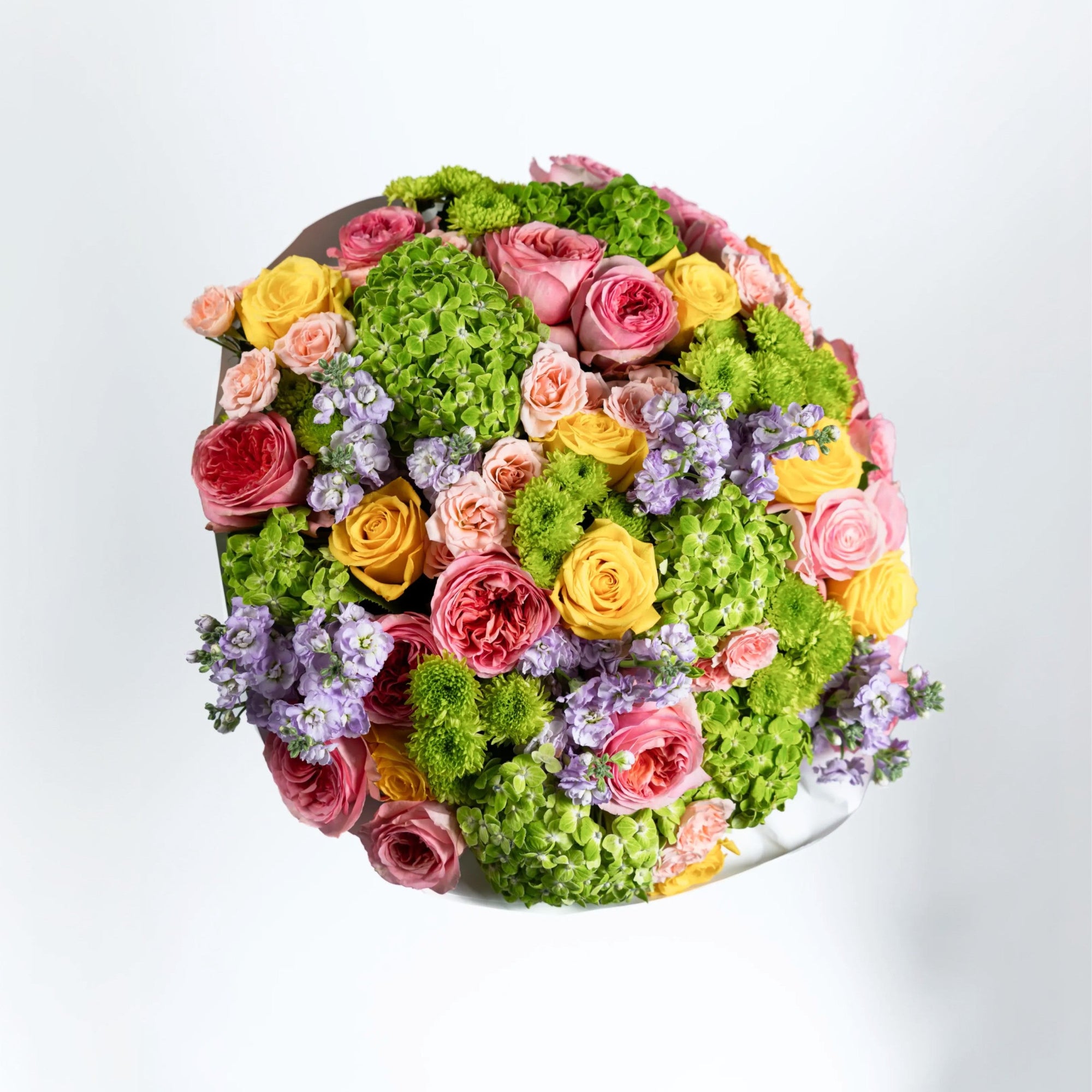 Top view of The Jardin Rhapsody with green hydrangeas, pink garden roses and yellow roses