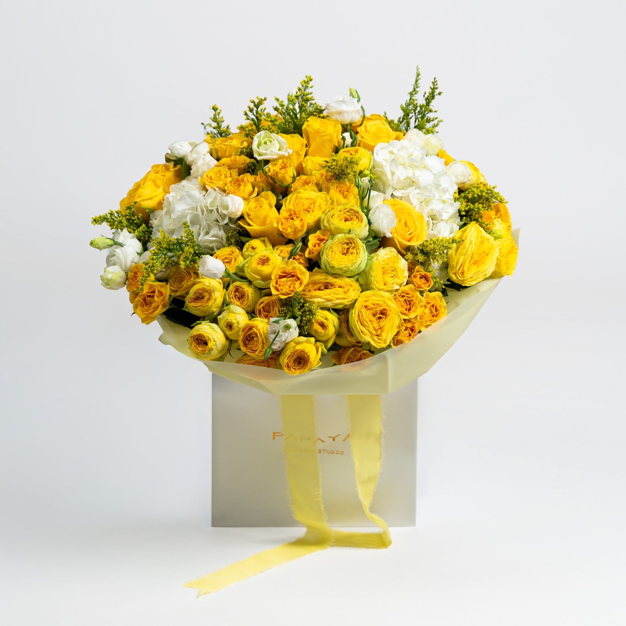 The Soleil Poème luxury yellow rose and ranunculus bouquet with white hydrangeas by Papaya Flowers